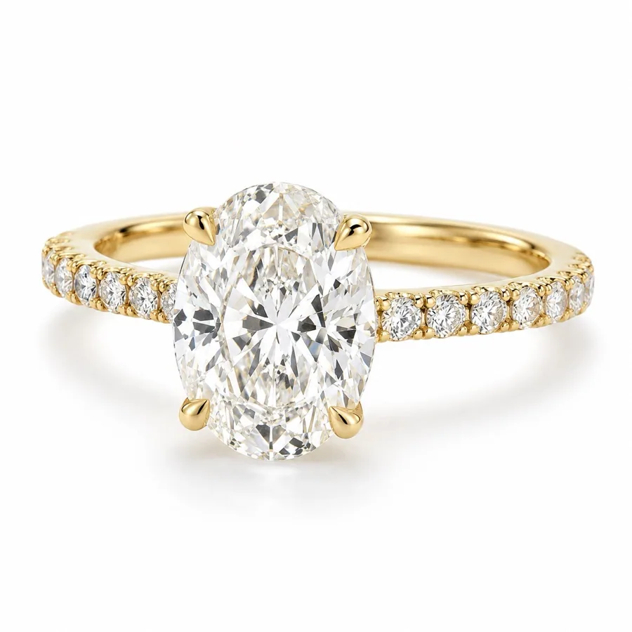 An oval diamond ring with a pave band in yellow gold