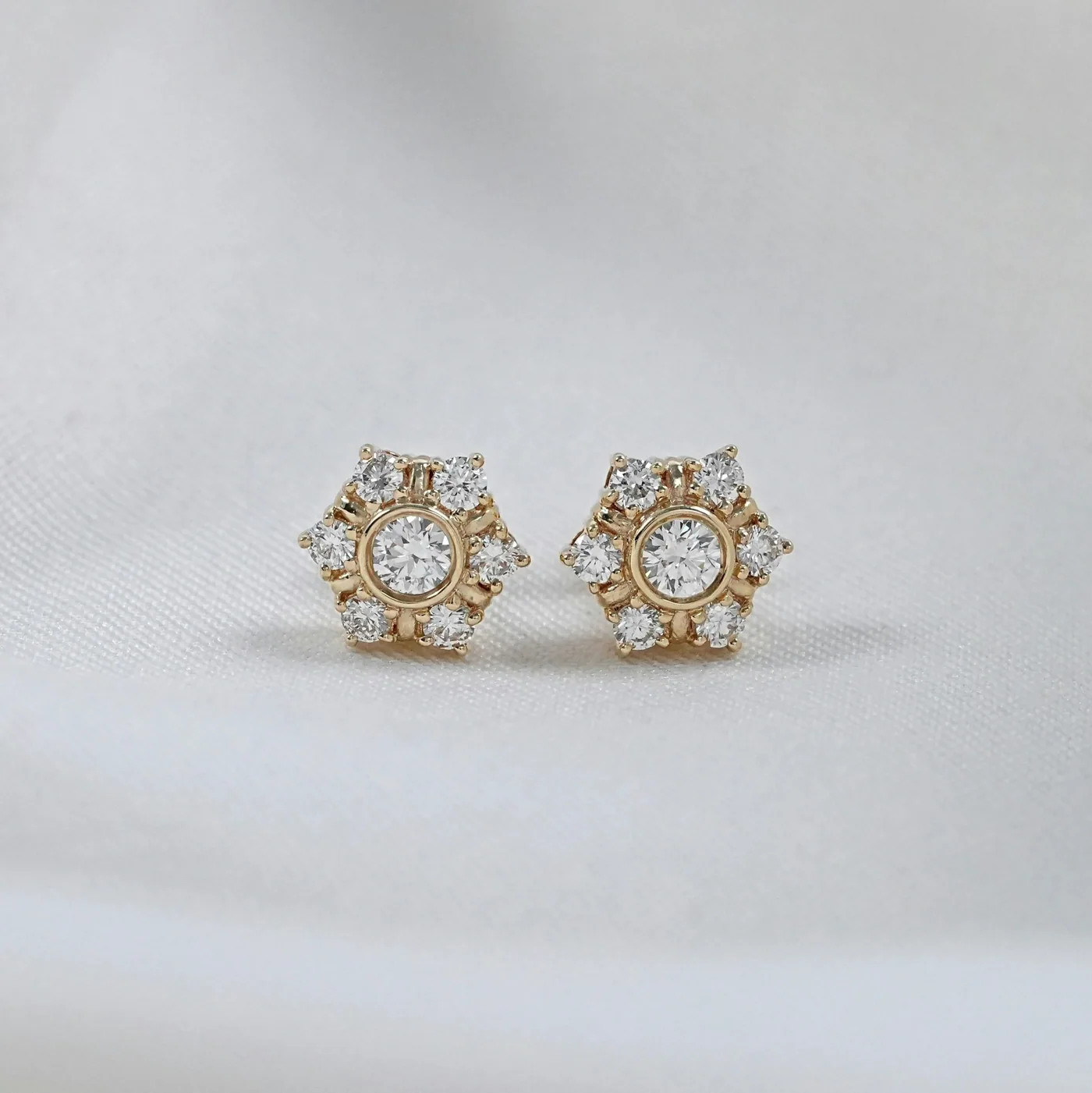 A pair of diamond cluster stud earrings