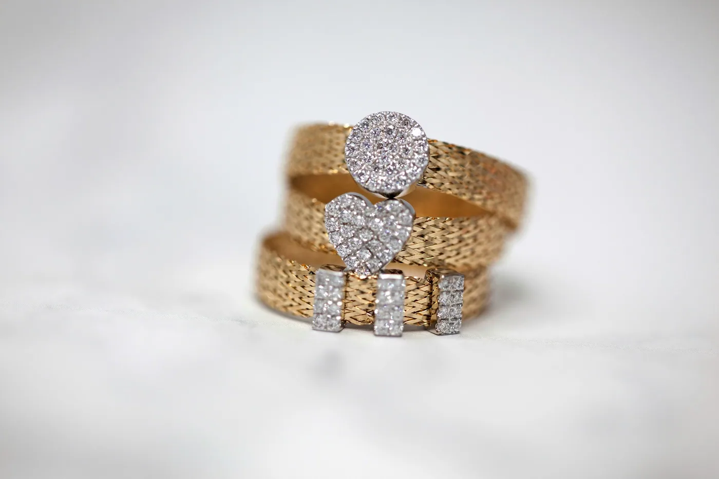 Stacked diamond rings on a hand